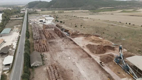 Drone flying over storage of tree trunks in wood processing plant at rural area Stock Footage 221552648
