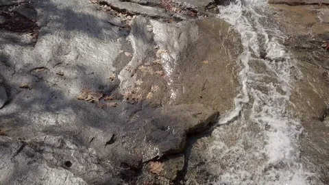 Drone flying over stream and cliff to reveal big waterfall in Vermont Stock Footage 106050492