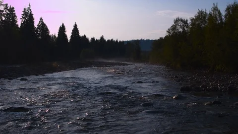 Drone flying over a stream in a forest among mountains 4k HDR H264 Stock Footage 88317805