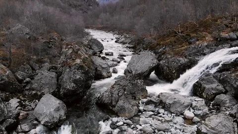 Drone Flying over a stream with waterfalls and rocks Stock Footage 92051938