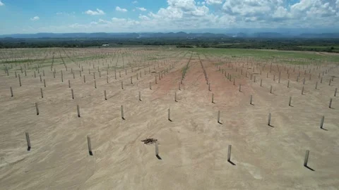 Drone flying over structural parts of a solar farm in construction Stock Footage 234956558