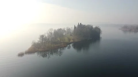 Drone Flying Over A tiny quiet island over the Lake in a winter cold day Stock Footage 170159296