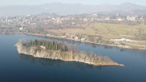 Drone Flying Over A tiny quiet island over the Lake in a winter cold day Stock Footage 170159388