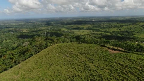Drone flying over the top of a mountain with tropical trees on it, vacation, 4k Stock Footage 154804086