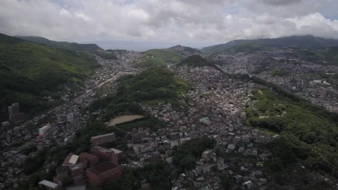 Drone flying over town in the mountains in japan Stock Footage 229926076