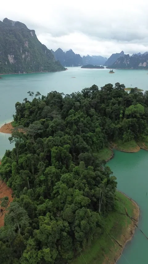 Drone flying over tropical jungle islands at Khao Sok National Park Stock Footage 336486552