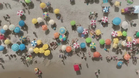 A drone flying over umbrellas Stock Footage 146101264