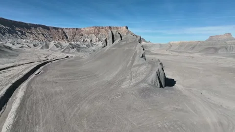 Drone flying over unique mountain in the middle of Caineville Utah desert Stock Footage 165567066