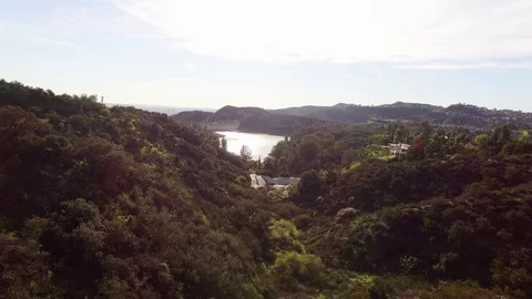 Drone Flying Over Valley to Lake Stock Footage