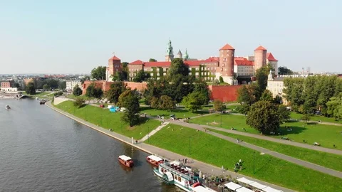 Drone flying over Vistula River towards Wawel Royal Castle, Krakow Poland Stock Footage 99323423