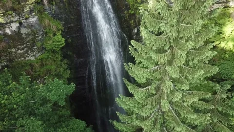 Drone flying over a waterfall 4k Stock Footage 137920932