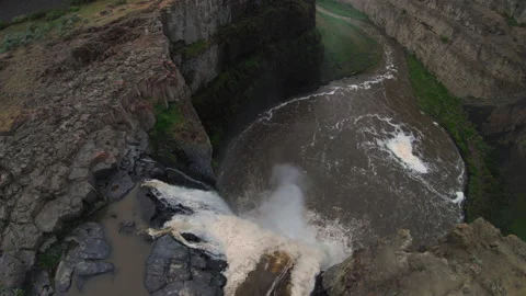 Drone Flying Over Waterfall Cliff Edge to Big Canyon Drop Stock Footage 131765013