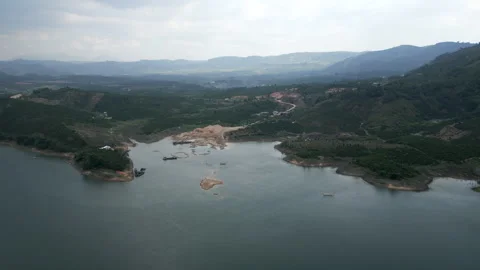 Drone flying over the waters of the great lake on a cloudy day between the Stock Footage 280325356