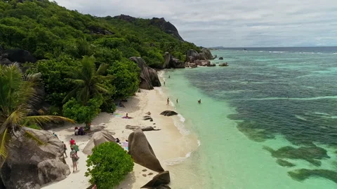 Drone flying over white, sandy beach on tropical island. HD50p Stock Footage 242427405