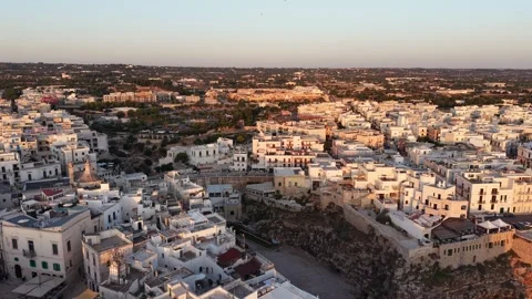 Drone flying over the whitewashed historic center of polignano a mare Stock Footage 340149209