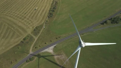 Drone Flying Over Wind Turbine with Slight Downward Camera Angle Stock Footage 314940410
