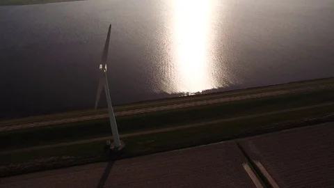 Drone flying over windmill and dike in Flevoland Stock Footage 75351245