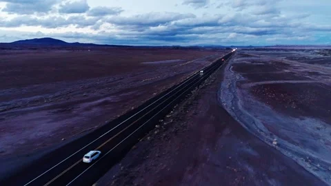 Drone Flying Parallel to Desert Highway in USA at Dusk With Sparse Traffic Stock Footage 313474668