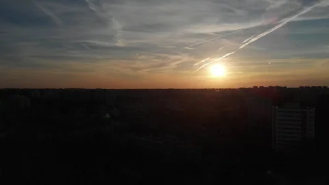 Drone flying parallel to sunset over city Stock-Footage 105166776