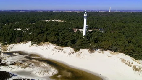 Drone flying pass tall lighthouse, drone stock footage by DroneRune Video stock 128076434