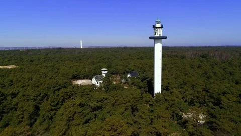 Drone flying pass tall lighthouse, drone stock footage by DroneRune Stock Footage 128101783