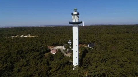 Drone flying pass tall lighthouse, drone stock footage by DroneRune Stock Footage 128102011