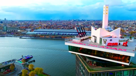 Drone Flying Past A'DAM Tower Towards Amsterdam Central Station 4K Video stock 334723929