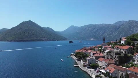 Drone Flying Past Perast with Views of Our Lady of the Rocks and Saint George Stock Footage 313900671