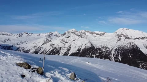 Drone flying past summit cross on snowy mountain ridge Video stock 145802842
