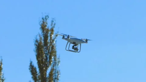 Drone flying. Quadrocopter in the sky, blue, slow motion Vídeo Stock 202743429