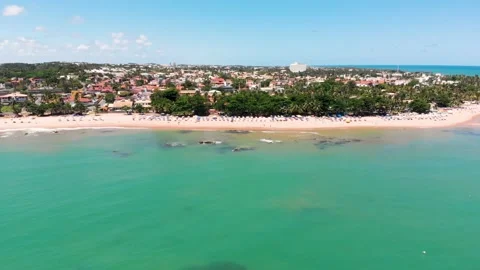 Drone flying from right to left showing the shore of Itapuã beach, Vídeo Stock 132332844