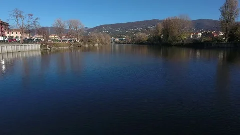 Drone flying up river in Italian while ascending Stock Footage 76936481