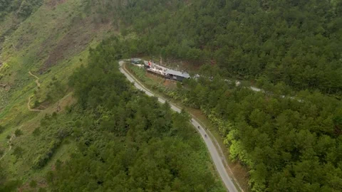 Drone flying to roadside stop on mountain pass with motorbikes Ha Giang Loop Video stock 313798275