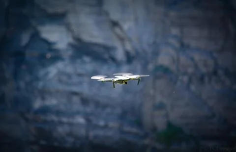 Drone Flying with Rocks in Background Stock Photos