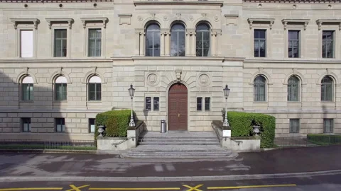 Drone flying to sea starting close at parliament building in Zug in switzerland Stock Footage 238002760