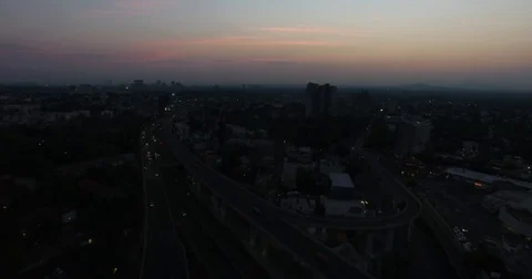 Drone flying side of national flag in San Jeronimo Mexico City sunrise Vidéo 74626569