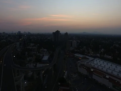 Drone flying side of national flag in San Jeronimo Mexico City sunrise Vidéo 74626596