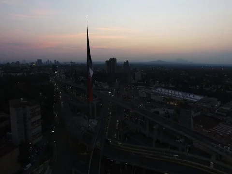 Drone flying side of national flag in San Jeronimo Mexico City sunrise Vidéo 74626807