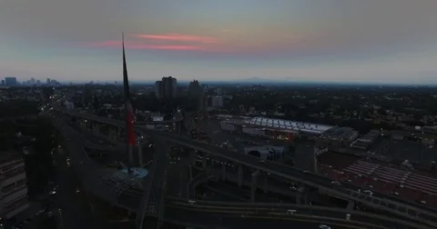 Drone flying side of national flag in San Jeronimo Mexico City sunrise Vidéo 74629840