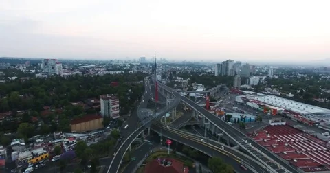 Drone flying side of national flag in San Jeronimo Mexico City sunrise Vidéo 74630023