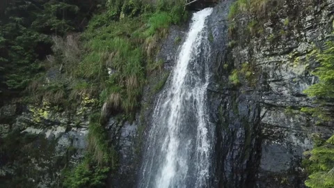 Drone flying from the side of a waterfall 4k beautiful landscape Stock Footage 137921110