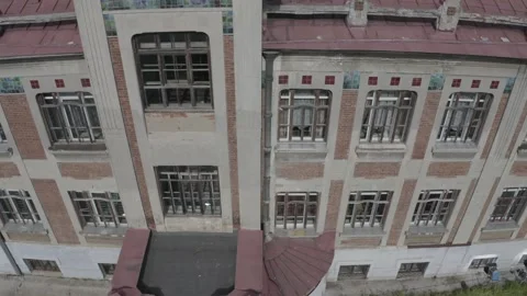 Drone flying sideways along historic building facade Stock Footage 333011304