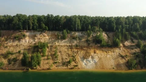 Drone flying sideways along river cliff Stock Footage 325135055