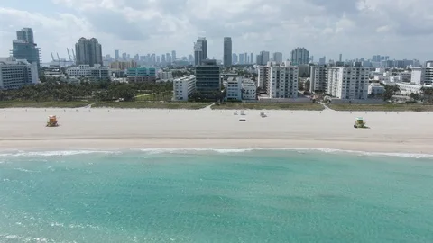 Drone Flying Sideways Facing Empty South Beach During Coronavirus Lockdown Stock Footage 127064454