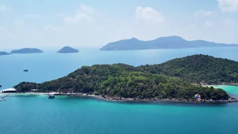 Drone flying sideways over a tropical beach and emerald sea in Nam Du 4K Stock Footage 333938966