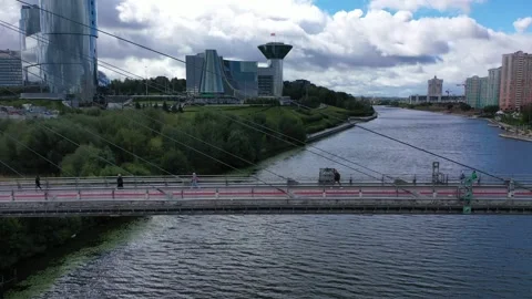 Drone flying sideways right along Pavshinsky pedestrian bridge Stock Footage 326939329
