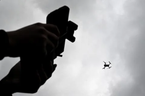 Drone is flying in the sky. Operator controls the drone.  War in Ukraine Fotos Stock