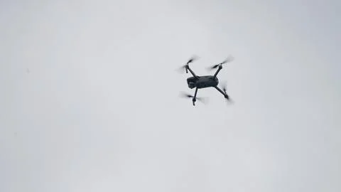 Drone flying in the sky. Stock Photos