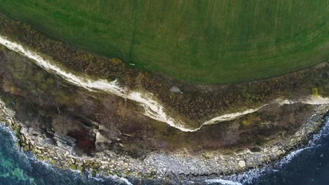 Drone flying slowly forwards over Stevns Klint Unesco World Heritage Stock Footage 272293490
