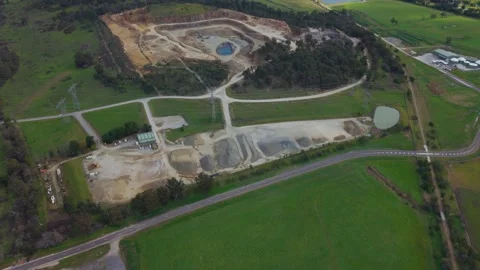 Drone flying slowly over an open-pit mine quarry Видео 343623454